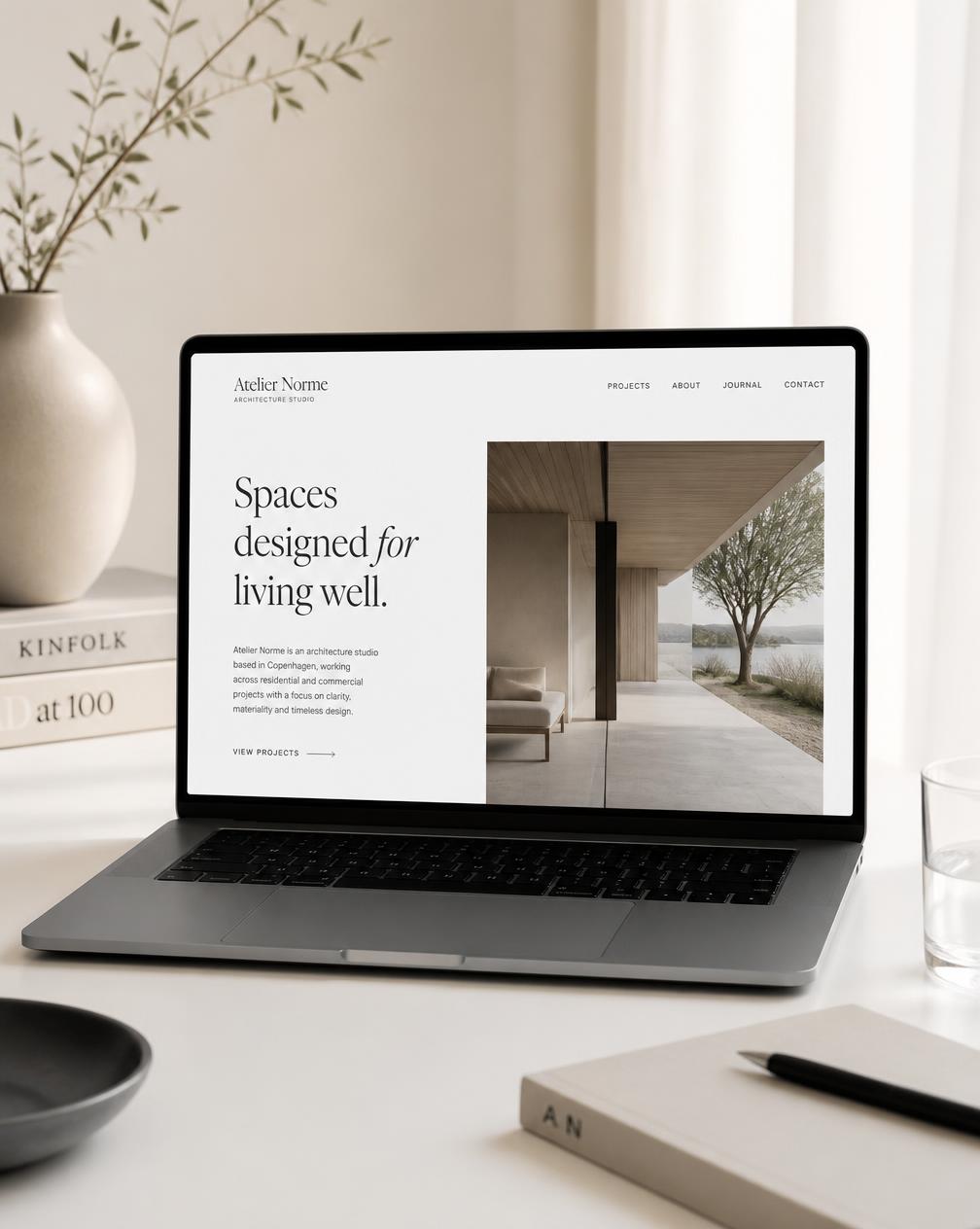 Architecture studio portfolio website on a laptop
